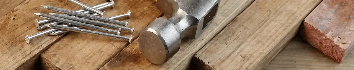 Hammer and nails on hardwood flooring boards in Chula Vista, CA