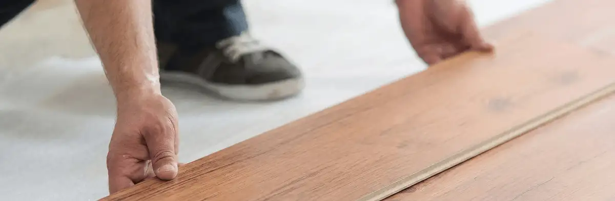 A professional installing laminate flooring in Chula Vista, CA