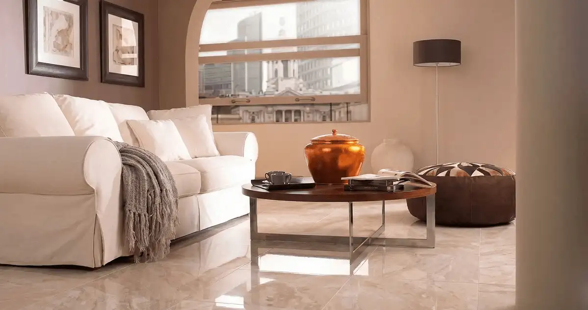 Modern living room with professionally installed marble flooring, a beige sofa, coffee table in Chula Vista, CA