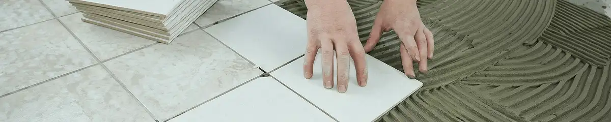 Professional installing white tile floors in Chula Vista, CA